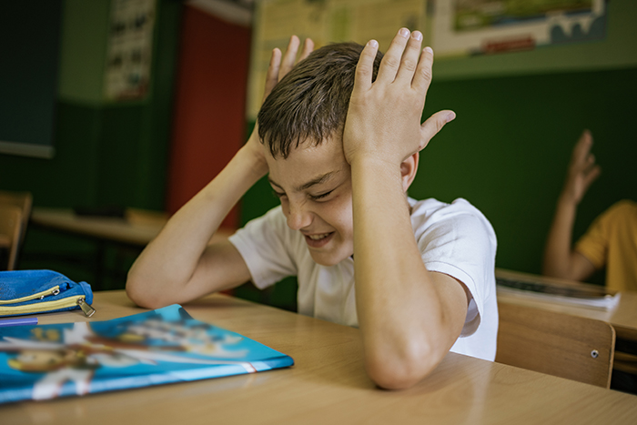 Boy with ADD frustrated at school